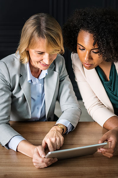 two ladies discussing digital marketing strategies